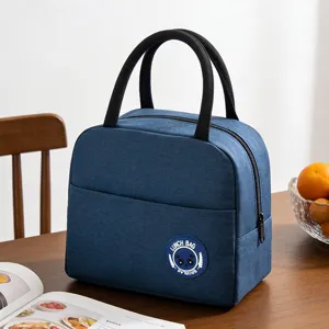 Insulated lunch bag with thermal foil lining, durable fabric tote for work and school use.