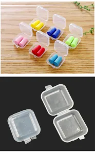 Detailed view of small clear plastic storage boxes with colorful foam earplugs inside.