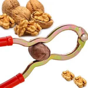 Multifunctional metal nutcracker with red handles, durable nut cracker tool for walnuts.