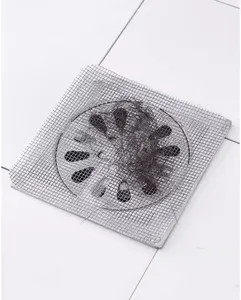 Disposable self-adhesive floor drain hair catcher mesh sticker for bathroom and kitchen sink use.