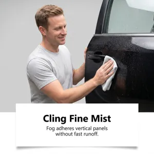 Car adhesive cleaner spray detail showing effective application on vehicle door surface.