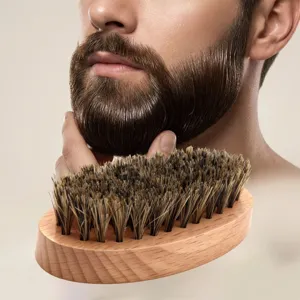 Close-up detail of boar bristle beard brush with wooden handle for daily grooming and care.