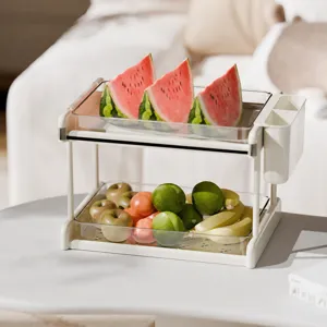 Organizer da scrivania a due livelli in stile crema con vassoi trasparenti per snack e tazze.
