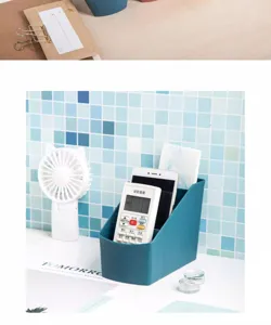 Desktop storage box detail view, multi-compartment organizer for remote control and phone.