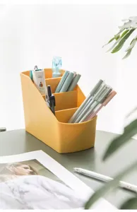 Multi-compartment plastic desktop storage box detail, perfect for pens, stationery and office supplies.