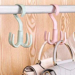 Multi-functional rotatable four-claw plastic hook for clothes, bags and home organization.
