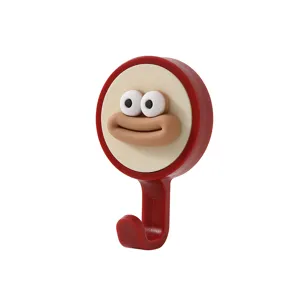 Funny rotating wall hook with cute cartoon face, punch-free strong adhesive hanging for home.