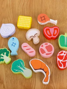 Close-up detail of colorful wooden play food kitchen toy pieces, safe and smooth for kids.
