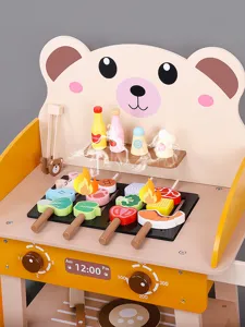 Wooden kids BBQ grill toy detail view, cute bear design with interactive food skewers and knobs.