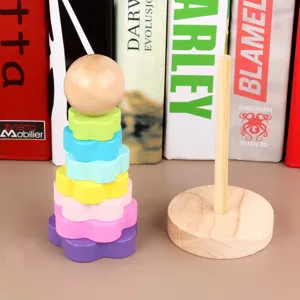 Jouet de tour d'empilement arc-en-ciel en bois avec anneaux de fleurs colorés pour enfants.