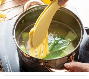 Leaf-shaped silicone food tongs detail view, high temperature resistant cooking tool for kitchen.