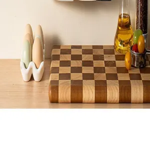 Wooden checkered cutting board kitchen chopping block with egg holder and oil bottle props.
