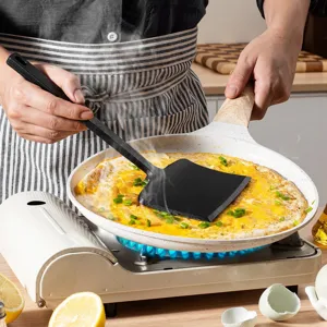 Ergonomic integrated silicone spatula non-stick wide turner for frying pancakes and eggs.