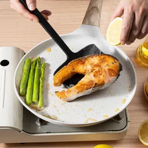 Heat resistant silicone spatula for non stick pan cooking, durable kitchen cooking tool.