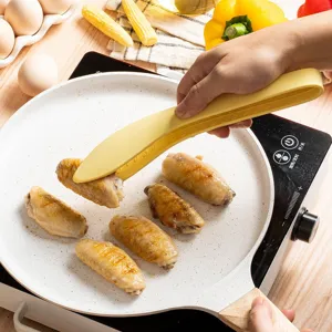 Heat-resistant silicone food tongs kitchen cooking tool with leaf shape design for steak BBQ.