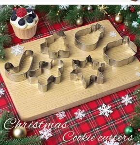 Stainless steel Christmas cookie cutters set detail showing intricate shapes like tree and snowman.