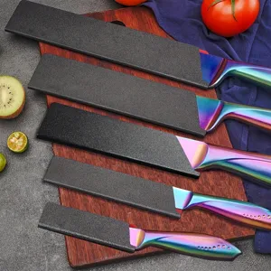 Kitchen knife set with rainbow stainless steel handles and protective covers for cooking food.