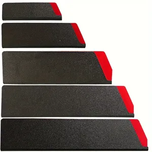 Universal plastic knife guards in multiple sizes, black sheaths with red tips for kitchen knives.