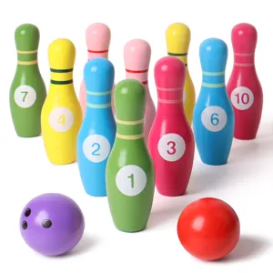 Wooden children bowling toy set, colorful pins and balls for indoor family interactive play.