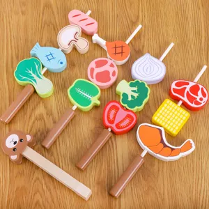 Kids wooden BBQ grill toy set with colorful food skewers and bear clip for pretend play cooking.
