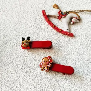 Pinces à cheveux renne et bonhomme de pain d'épices de Noël, adorable accessoire festif.