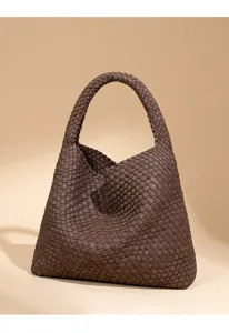 Detailed view of the brown woven leather shoulder bag showcasing soft texture and stylish design.