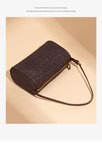 Dark brown woven leather cylindrical shoulder bag, retro style pillow bag detail display.