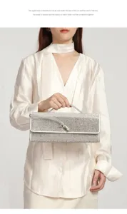 Close-up of sparkling rhinestone evening clutch bag with metallic lock and refined handle.