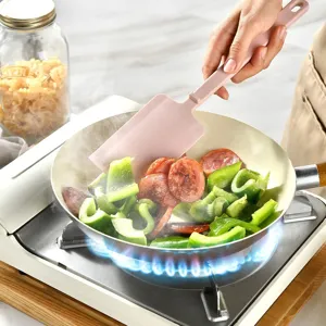 Heat resistant silicone spatula for cooking and baking, durable integrated kitchen tool in pink.