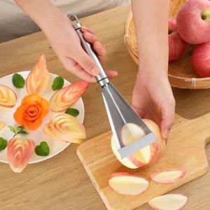 Scene of using a stainless steel fruit carving tool to slice fresh apples on wooden board.