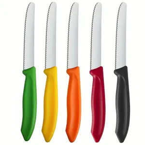 Detailed close-up of stainless steel steak knives with colorful plastic handles and serrated blades.