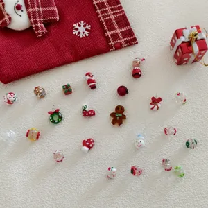 Christmas glass bead charms detail, handmade DIY jewelry accessories, festive snowman decor.