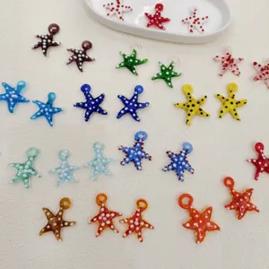 Colorful glass starfish pendants, close-up view of DIY beading jewelry making accessories.