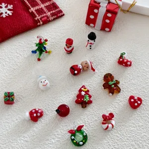 Christmas glass beads DIY jewelry accessories details, cute handmade festive pendants for crafting.