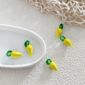 Glass fruit charm beads detail shot, yellow and green DIY jewelry making accessories necklace.