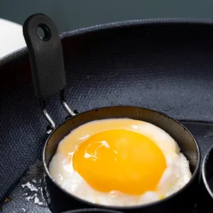 Non-stick fried egg mold with anti-scald handle kitchen cooking egg ring tool for breakfast.