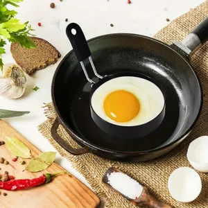 Stainless steel non-stick egg frying ring tool for cooking perfect round fried eggs easily.