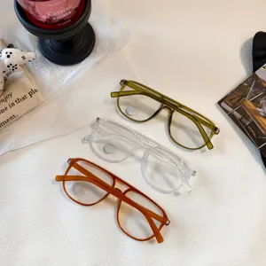 Detail view of vintage double bridge pilot sunglasses in multi colors, clear fashion frames.