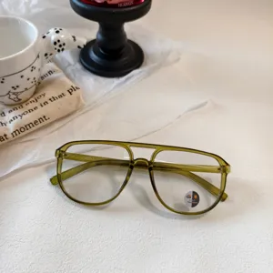 Detailed view of vintage green double bridge aviator optical glasses frame, classic design.