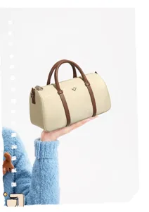 Chic borsa Boston bicolore, versatile borsa a cuscino cilindrica con comodi manici.