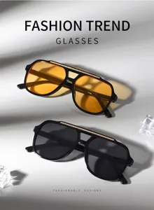 Détail de lunettes de soleil tendance à double pont avec des verres jaunes et noirs.