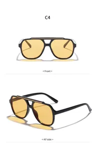 Lunettes de soleil oversize tendance avec verres jaunes et monture noire pour le style.