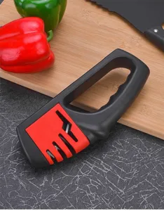 Kitchen knife sharpener detail, multifunctional tool for sharpening blades and scissors quickly.
