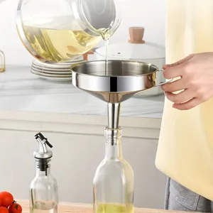 Stainless steel kitchen funnel detail showing liquid pouring, perfect for oil or wine filtering.