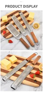 Stainless steel cheese grater with wooden handle, ideal kitchen zester tool for lemon zest.