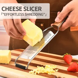 Stainless steel cheese grater and lemon zester with wooden handle for kitchen use.