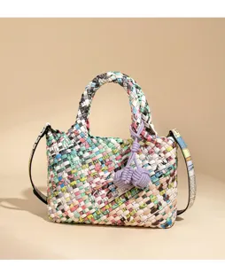 Colorful newspaper print woven handbag, stylish leather crossbody shoulder tote bag for women.