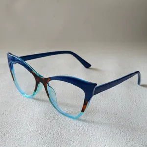 Detailed view of the trendy cat-eye blue light blocking glasses frame with chic color block design.