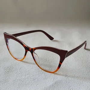 Close-up detail of stylish color-block cat eye blue light blocking glasses frame for women.