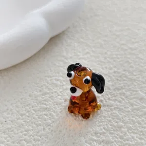 Detailed shot of a cute brown glass puppy animal bead, perfect for DIY jewelry making.